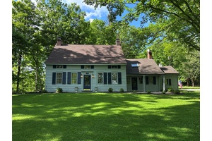 This historic home was originally built in Millbrook, New York in 1733 by one of the nine partners of the early English land grant.