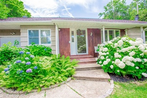 Welcome to this beautifully updated home in the desirable Ridgefield Highlands Association, offering private beach access and set on a generous 1 3 of an acre lot.