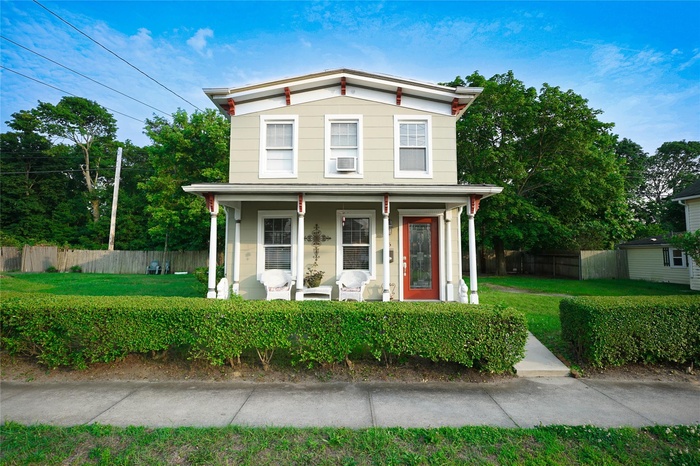 Italianate-style house featuring covered porch