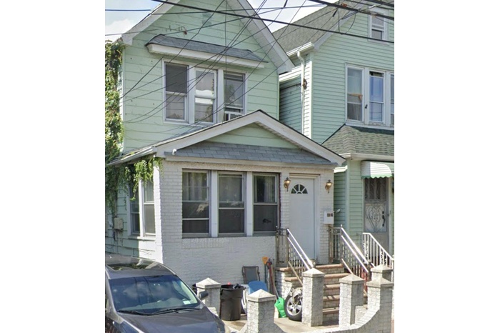View of front of house featuring brick siding