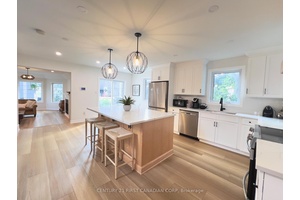 Enjoy breathtaking views from this beautifully designed, extensively updated, 3 bedroom, 4 bath home, just steps from the lake.