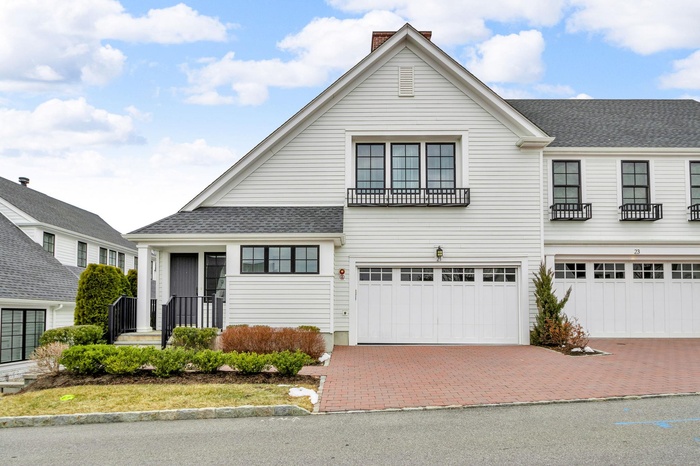 View of front of property with a garage