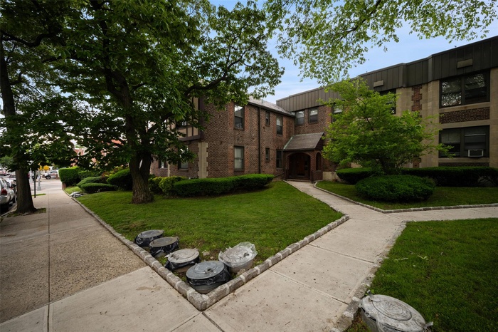 View of property's community with a yard