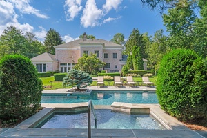 Welcome to this Magnificent Brick Masterpiece with Guest Pool House on Two Impeccable Resort Style Acres.
