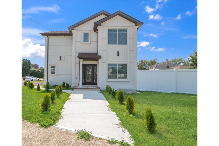 View of front of property featuring stucco siding