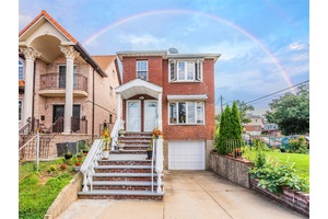 Spacious all brick legal two family Hi Ranch home featuring 3 bedrooms and 1.