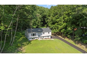 Amidst nature, surrounded by lakes, mountains, and the Appalachian Trail, this beautifully renovated raised ranch sits on a sprawling 1.