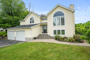 Discover the perfect blend of serenity and comfort in this stunning 4 bedroom, 3 bathroom raised ranch nestled on a sprawling 1.