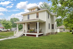 Introducing the Four Square House, a charming 1926 home restored with modern conveniences and historic appeal.