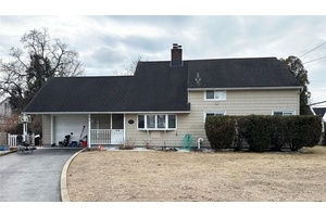 Rare one family cape in Levittown with a large 8349sf lot !