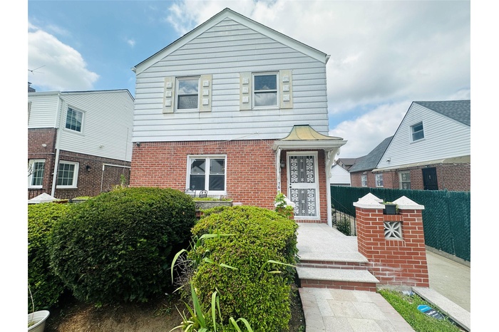 View of front of property with brick siding