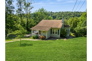 Fall in love with this newly renovated and modernized cottage on nearly 1 acre of private property.