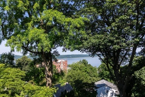 Outstanding year round Hudson River views await in this unique and newly renovated 2 bedroom 2 bath condominium just two blocks from downtown Dobbs Ferry.