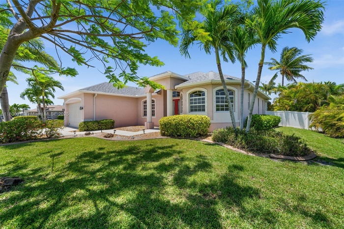 Beautiful, lush landscaping surrounds this home