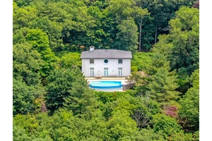 Welcome to sun infused Hill House, created in 1988 by designer Geoffrey Bradfield for himself.