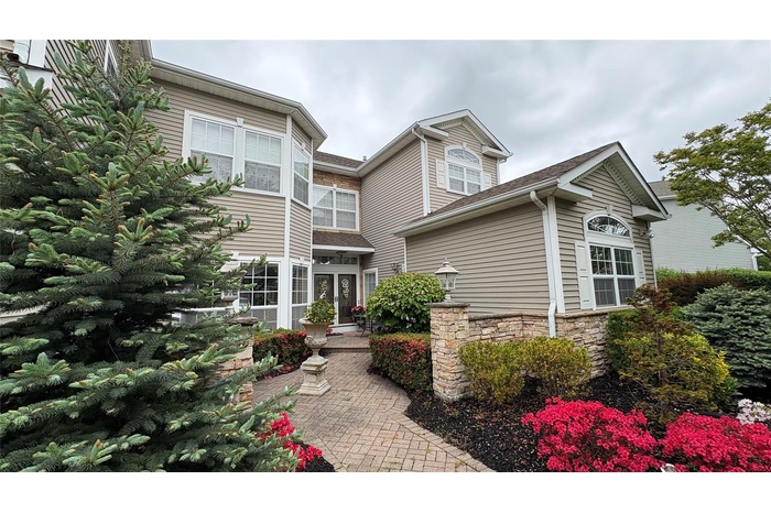 View of front of house featuring stone siding