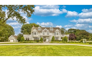 An inviting and impressive white stone drive welcomes you to this Magnificent, Nantucket Style Beach Cottage in the heart of the Village of Westhampton Beach.