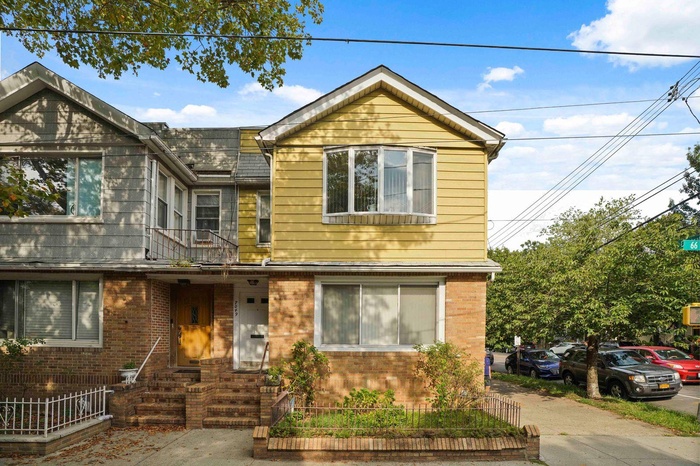 View of front of house featuring brick siding