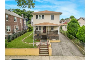 Discover this wonderful 2 Family Home nestled away in the heart of McLean Heights featuring a huge driveway and a 2 Car garage.