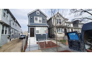 This beautifully renovated single family home offers a perfect blend of modern elegance and comfort.