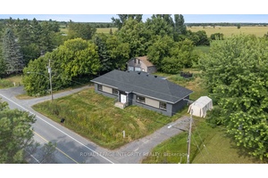 Updated and vacant side by side duplex with detached over sized double car garage amp ; loft sitting on a generous 0.