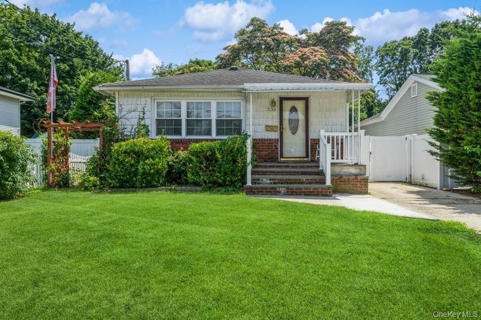Bungalow-style house featuring concrete driveway and a shingled roof