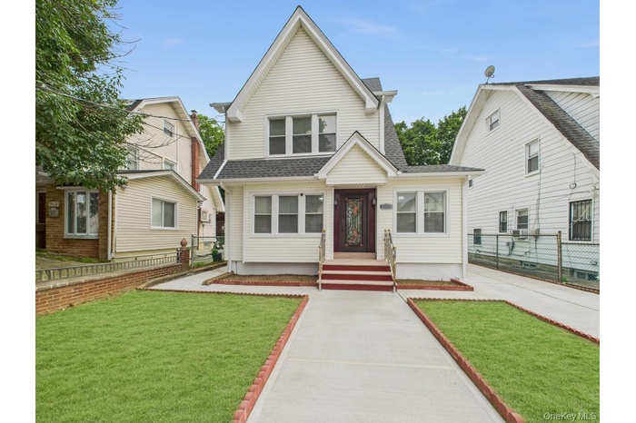 View of front of property with roof with shingles