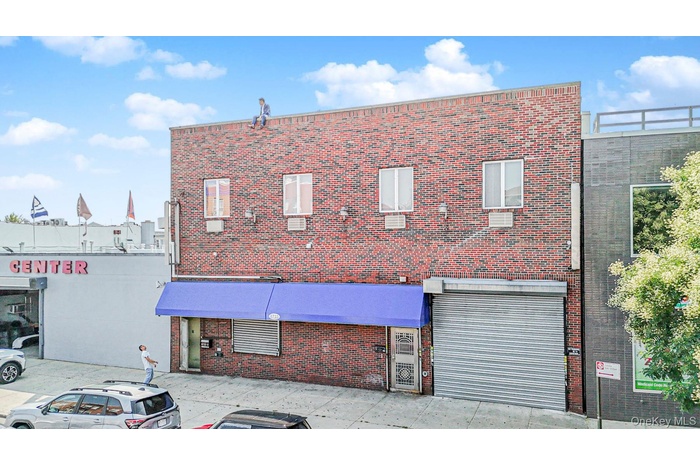 View of building exterior featuring a garage