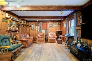 Welcome to 2 Couzines Rd in Woodbourne, NY where handcrafted beauty, privacy, and possibility come together on over 7 acres of serene land.