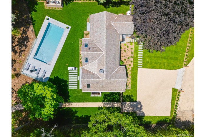 View of subject property featuring a pool