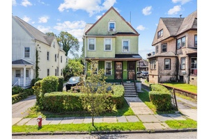 Welcome to 20 Adams Street, a detached 2 family on an oversized 30 x 142 lot on a quiet residential street with a private driveway, detached garage, and covered porch.