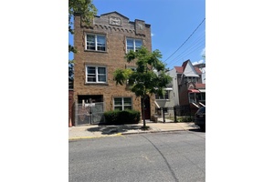 Spacious and Well Maintained 3 Family Detached Brick Home in the Wakefield Neighborhood.