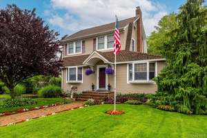 Pride of ownership is immediately evident in this meticulously maintained Colonial home.