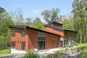 Discover minimalist modern luxury in this stunning new contemporary home, set on an expansive 7.