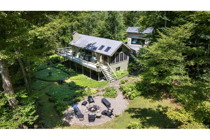 View from above of property with a forest