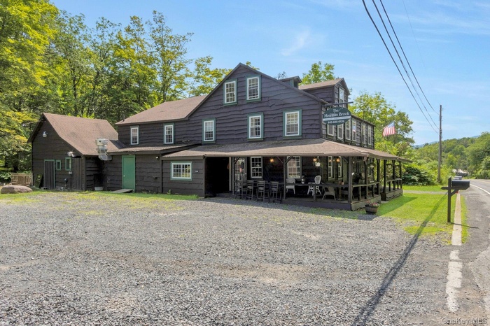 View of front of property with a sunroom