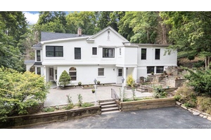 Discover a rare opportunity to own a beautifully updated estate in the prestigious Village of Muttontown.