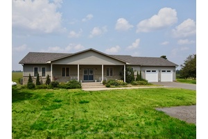Set on a quiet public road and surrounded by scenic farmland, this beautifully maintained 2 1 bedroom, 4 bath bungalow sits on a private, nearly 1 acre lot and offers ...