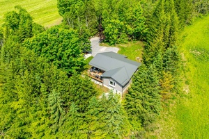 Welcome to 4045 Bowman Rd, a serene and beautifully updated country estate nestled on 57 acres in the rolling hills of Northumberland, just minutes from Cobourg and the 401.