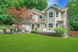Enjoy privacy and serenity on the pastoral grounds of this five bedroom home with close to 1.