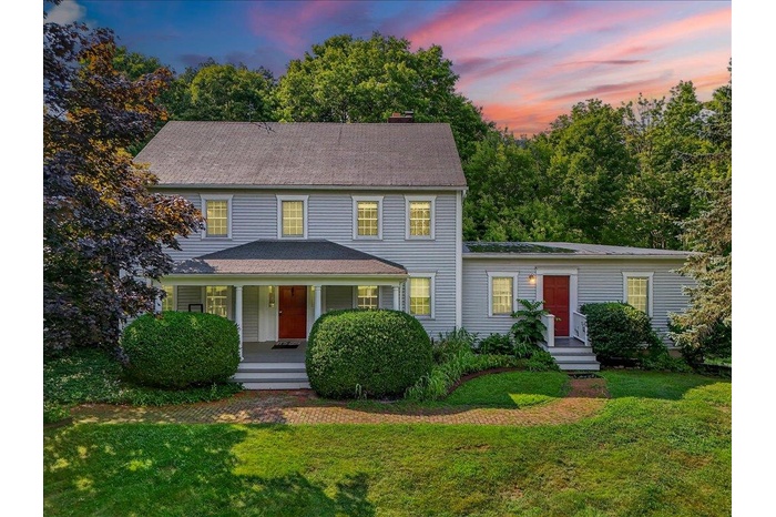 Front of house with covered porch.