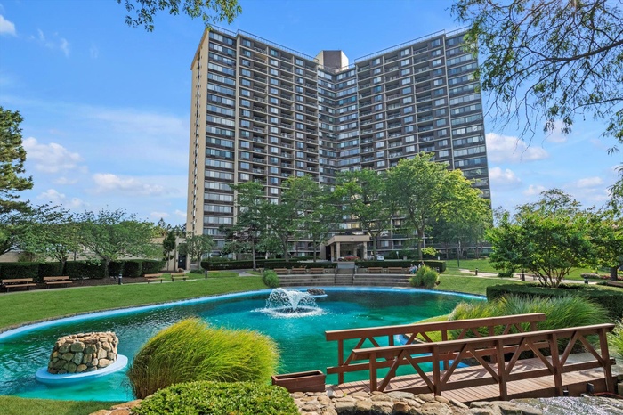 View of swimming pool featuring a yard