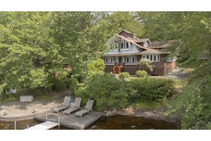 Nestled on an iconic 0. 77 acre lakefront parcel, Chalet Sunset offers a rare opportunity to own a nostalgic seasonal retreat in the heart of the cherished Wanaksink Lake community.