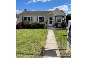 Charming 3 bedroom, 1 bath Ranch in West Babylon featuring a full attic, eat in kitchen, and spacious yard.
