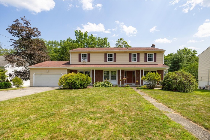Traditional-style colonial home with front porch
