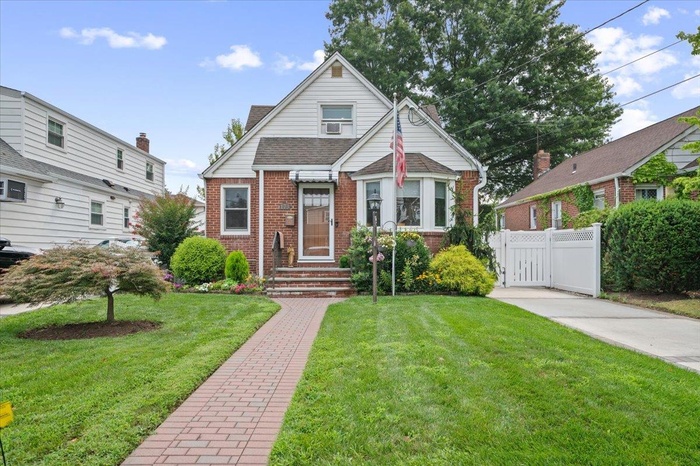 Bungalow-style house featuring brick siding