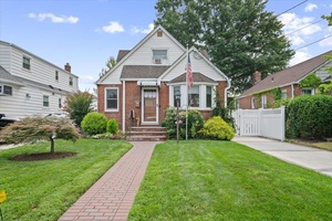 Step into this fully renovated expanded cape in the heart of Franklin Square !