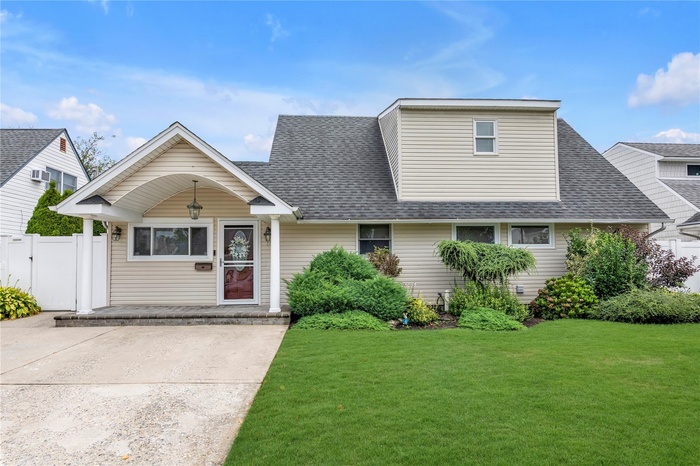 View of front of property with a shingled roof