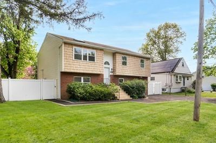 Raised ranch with brick siding