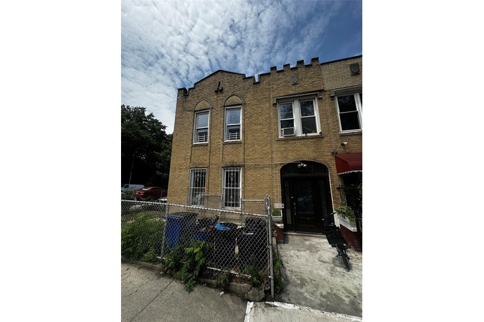 View of front of property featuring brick siding